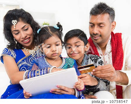 Indian Asian family online shopping with credit card 10758547