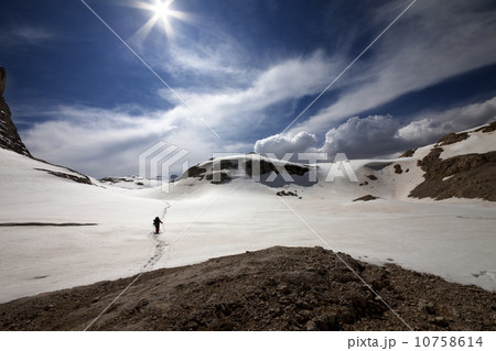 Hiker on snow plateau Hiker on snow plateau 10758614