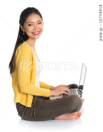 Side view Asian girl using notebook Side view Asian girl using notebook 10758918