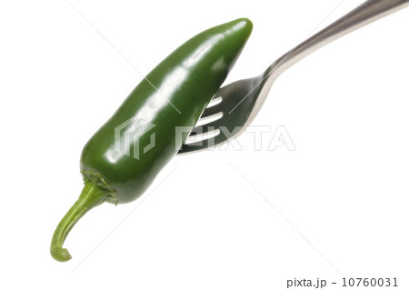 green hot chili on a fork, isolated on white green hot chili on a fork, isolated on white 10760031