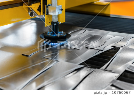 Machine cutting steel in a factory Machine cutting steel in a factory 10760067