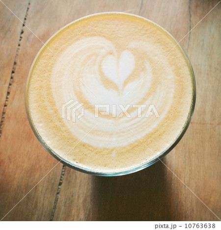 Cappuccino or latte coffee on table with retro filter effect 10763638
