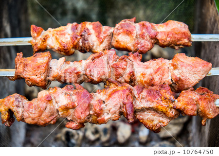 Hot shish kebab on metal skewers Hot shish kebab on metal skewers 10764750