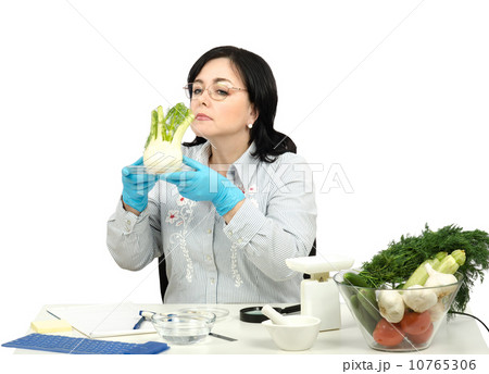 Phytocontrol technician smelling fennel 10765306