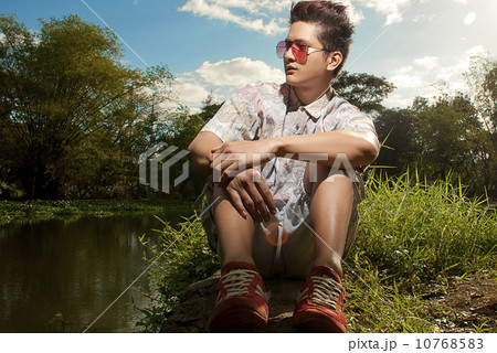 Asian man in printed polo 10768583