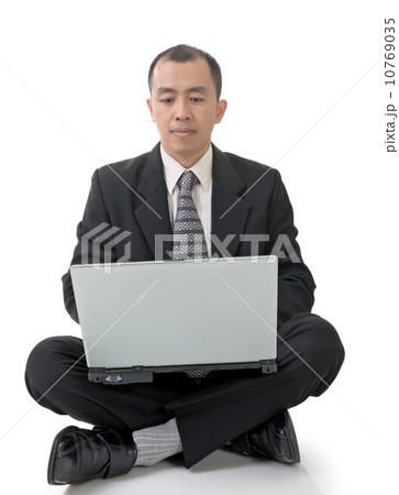 businessman using laptop on ground 10769035