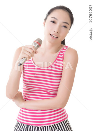 Asian girl take a microphone singing or speak 10769037