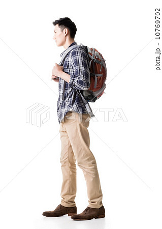 Side view of young Asian backpacker 10769702