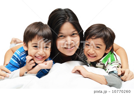 Mother And Sons Lying In Bed Together Mother And Sons Lying In Bed Together 10770260