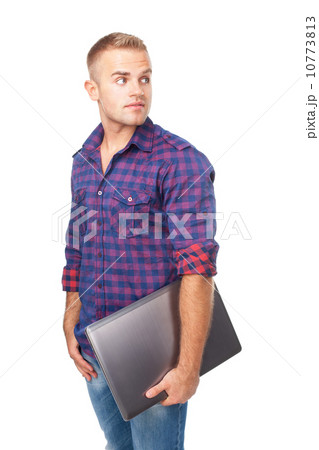 Portrait of smiling young man holding laptop 10773813