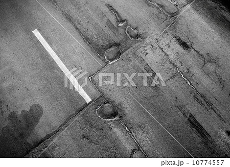 Road marking: white lines on the old asphalt road Road marking: white lines on the old asphalt road 10774557