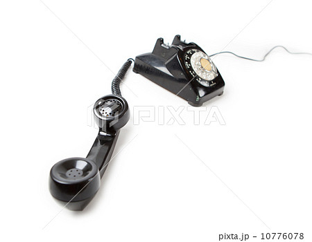 受話器の外れた黒電話器の写真素材