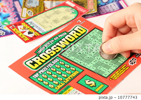 Scratching lottery ticket. Scratching lottery ticket. 10777743
