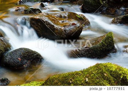Falls on the small mountain river in a wood shooted in autumn 10777931