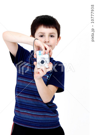 Young boy with digital camera Young boy with digital camera 10777938