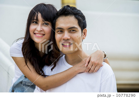 Lovely couple embrace on the stairs Lovely couple embrace on the stairs 10778290