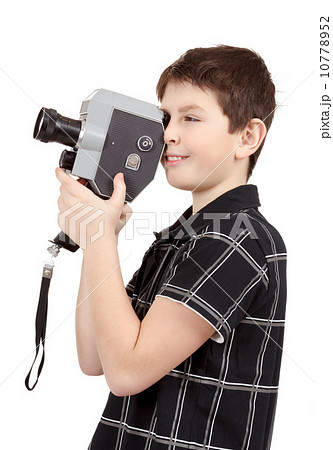 young boy with old vintage analog 8mm camera young boy with old vintage analog 8mm camera 10778952