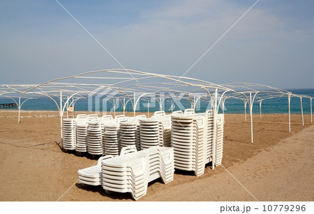 Empty beach with sun lounger Empty beach with sun lounger 10779296