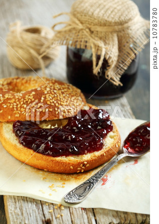 Homemade bagel with jam for breakfast. Homemade bagel with jam for breakfast. 10783780