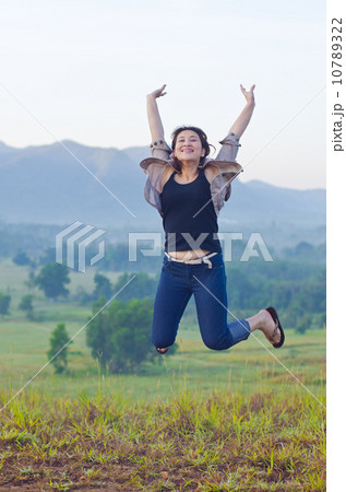 Pretty woman with opened arms expressing freedom Pretty woman with opened arms expressing freedom 10789322