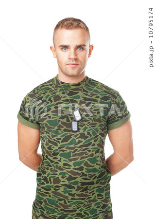 young serious army soldier with military ID tags 10795174