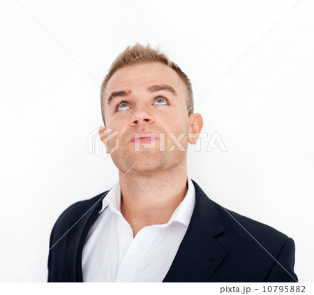 Thoughtful business man looking upward Thoughtful business man looking upward 10795882
