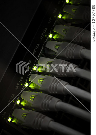 Network hub with green led lights and connected cables. Selectiv Network hub with green led lights and connected cables. Selectiv 10797789