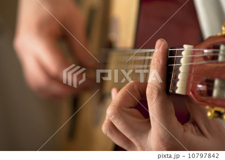 The musician plays a guitar 10797842