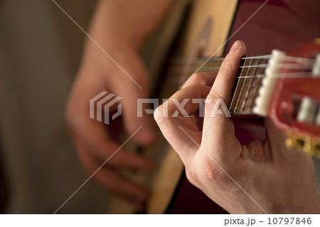 The musician plays a guitar 10797846