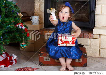 Little girl being happy about christmas present. Little girl being happy about christmas present. 10799277