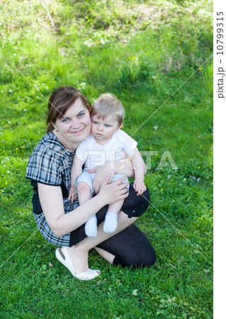 Young mother and sweet baby boy in summer forest 10799315