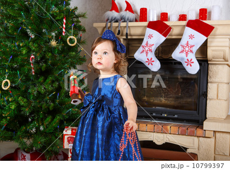 Little girl being happy about christmas present. 10799397