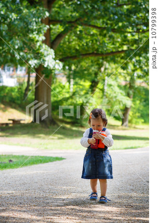 Little cute baby girl walking in summer park Little cute baby girl walking in summer park 10799398