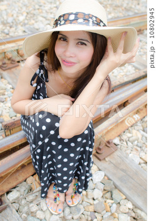Traveller girl sitting on the rail way 10802945
