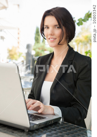 Woman laptop wifi outdoor cafe 10803342