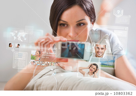Young pretty woman using social media on her smartphone 10803362