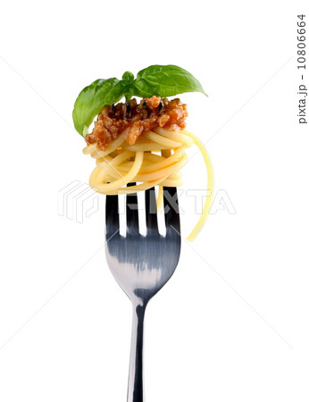 Spaghetti bolognese and basil on fork, close up 10806664