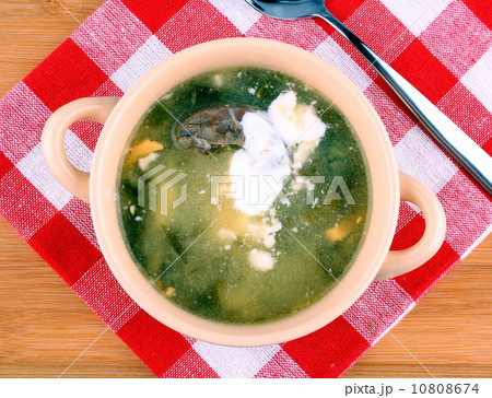 Green soup with egg, meat and cream 10808674