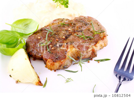 Herb Grilled steak meat with onion, basil and potato Herb Grilled steak meat with onion, basil and potato 10812504