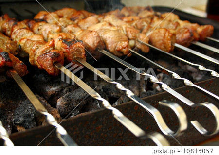 Marinated lamb grilling on metal skewer Marinated lamb grilling on metal skewer 10813057