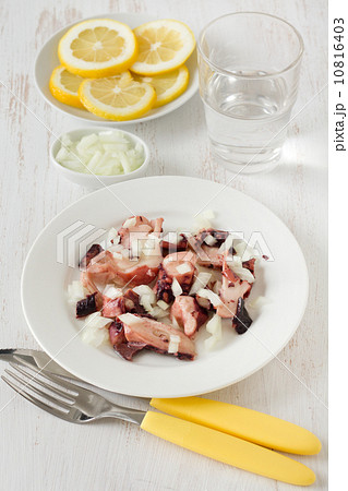 salad with octopus on the white plate 10816403