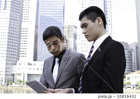 Asian businessmen outdoor with tablet 10816432