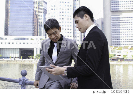 Asian businessmen outdoor with tablet 10816433