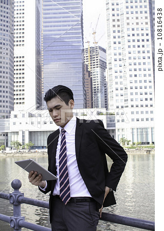 Asian businessman outdoor with tablet 10816438