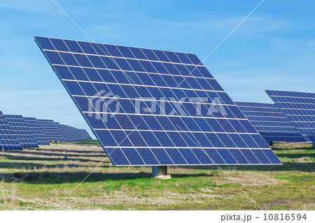 Station solar panels on a green lawn. For electricity generation. 10816594