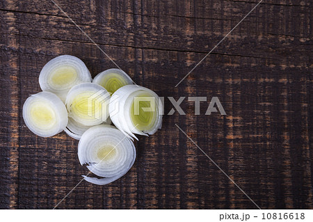 Sliced onion circles on a wooden board. With frame place for your text. Sliced onion circles on a wooden board. With frame place for your text. 10816618