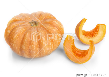 Cut pieces of pumpkin soup slices. On a white background. 10816792