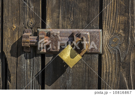 Old key lock on wooden door 10816867