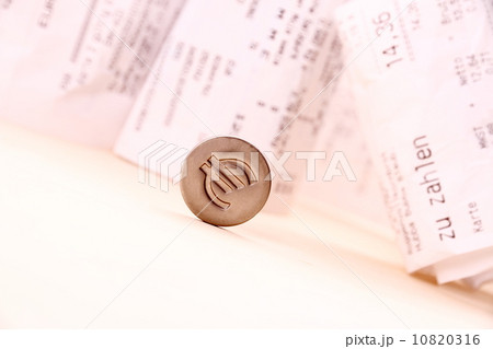 Euro symbol rolled down bills in background Euro symbol rolled down bills in background 10820316