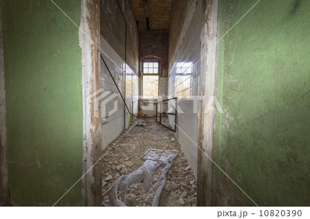 entrance to a ruinous bath with white tiled walls entrance to a ruinous bath with white tiled walls 10820390